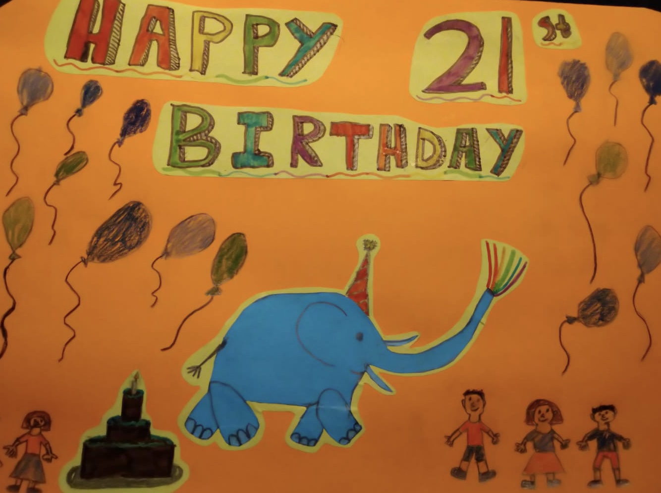 Under 10's entry reading Happy 21st Birthday, with a blue elephant on an orange background