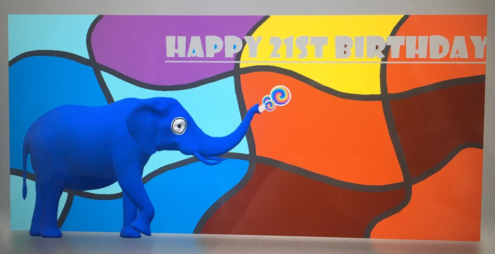 Digital entry reading Happy 21st Birthday with a image of an elephant coloured blue on the left hand side